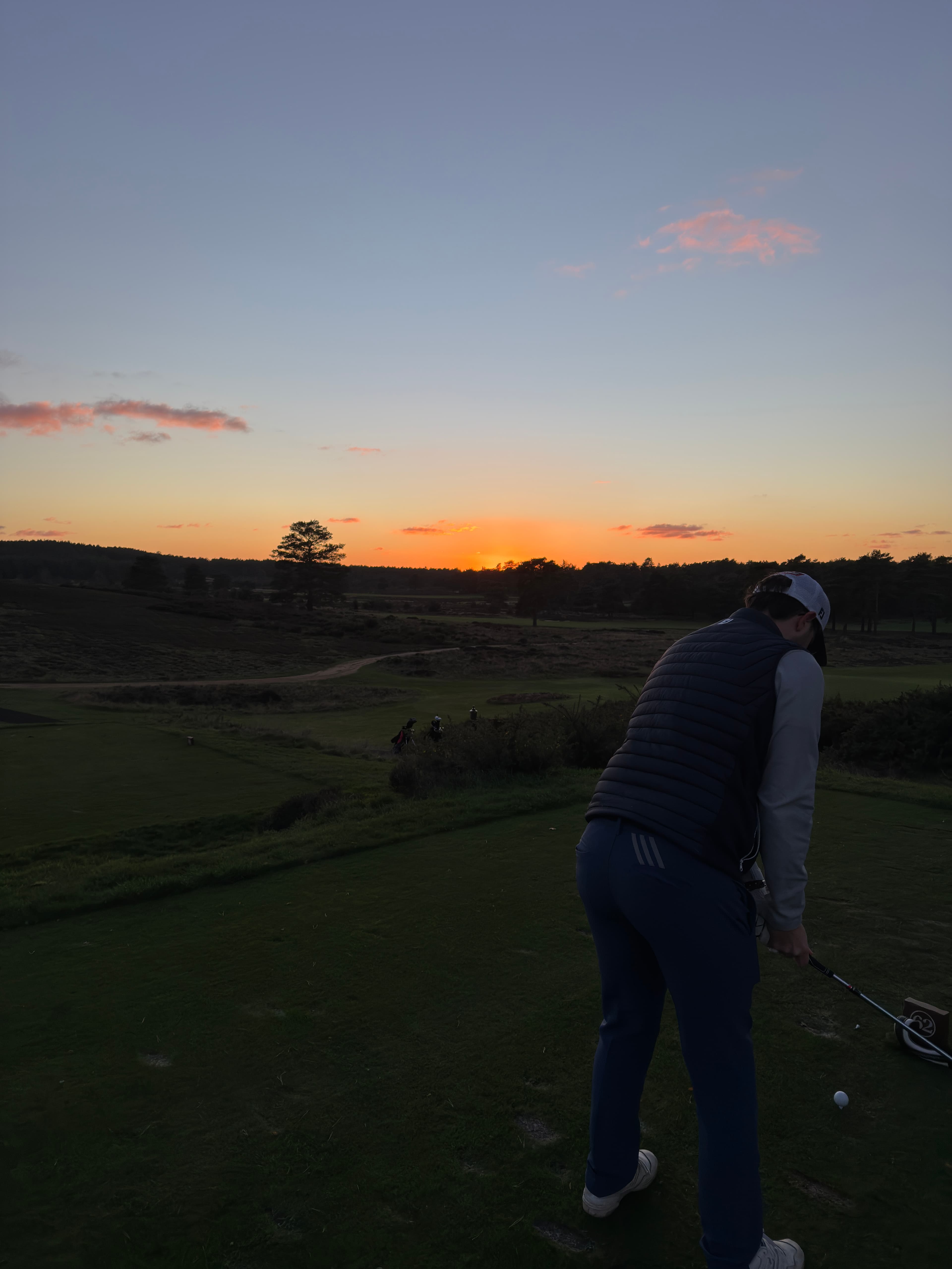 Jack playing a parkland course in Surrey at sunset